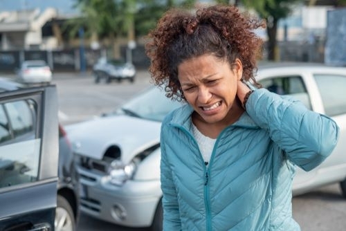 A woman with whiplash from a rear-end collision.
