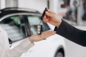 A Woman Takes a Rental Car Key