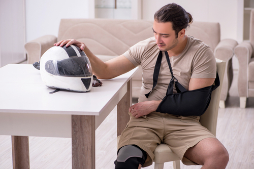 Motorcycle accident injury victim consulting a Johns Creek Motorcycle Accident Lawyer to help start his accident injury claims process. 