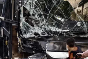 Busted bus window after an accident scene — Johns Creek bus accident lawyer helping injured victims recover compensation.