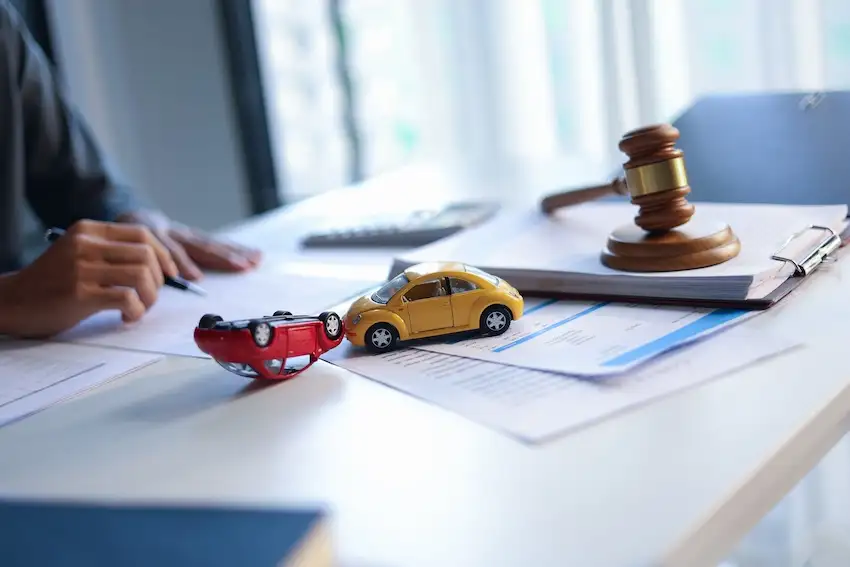Georgia car accident lawyer reviewing fault evidence and accident report for a multi-vehicle crash claim