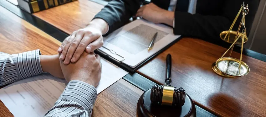 Injured Georgia driver consulting with a car accident attorney about fault determination in a multi-vehicle accident