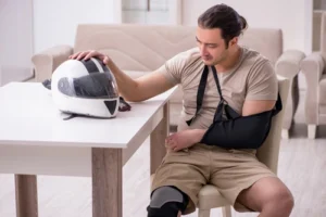 Motorcycle accident injury victim consulting a Johns Creek Motorcycle Accident Lawyer to help start his accident injury claims process.