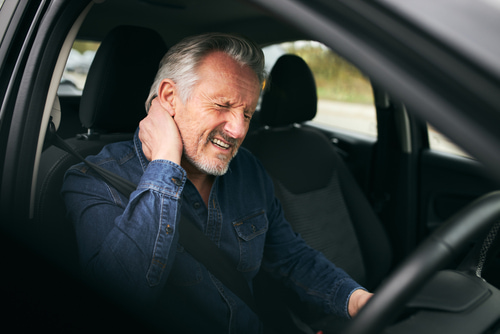 A senior man with a pre-existing condition suffers pain after a car accident.