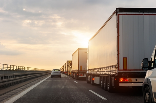 Trucks in a line on the highway