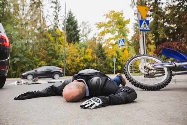 A man needs a motorcycle accident lawyer after being hit by a car on his motorbike.